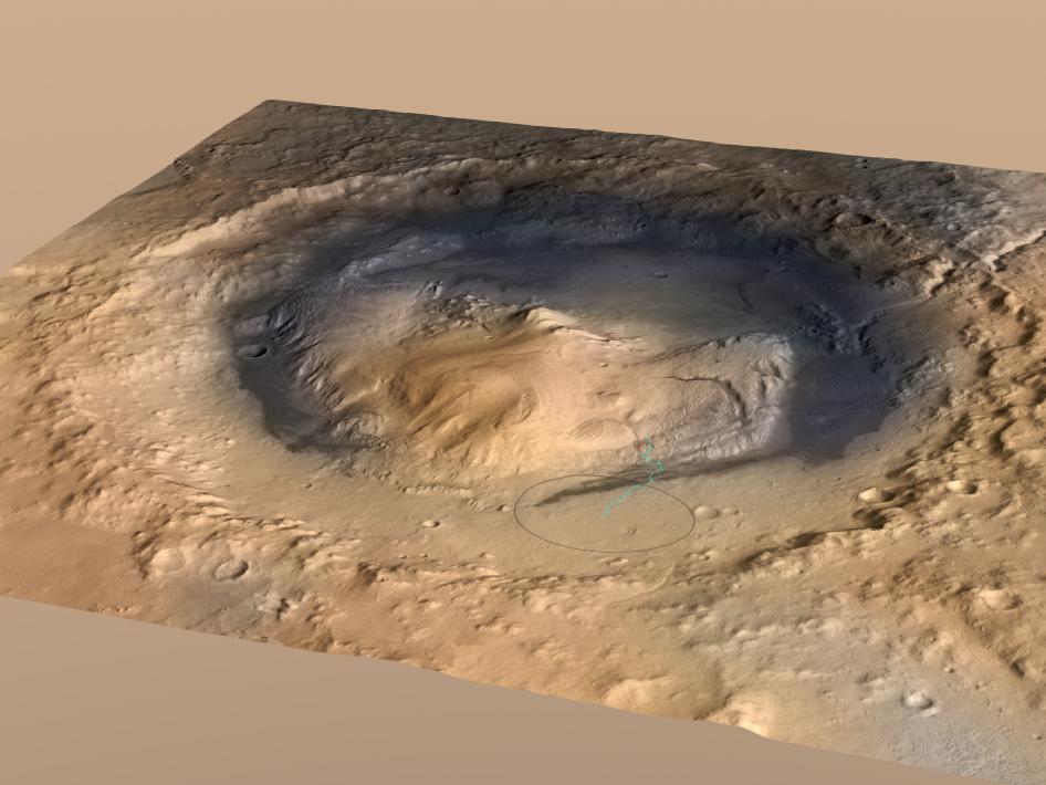 Overhead view of Gale crater with Mount Sharp in the center. At one time, Gale crater was a large lake or series of lakes. The ellipse is the landing area of the rover. Image Credit: NASA/JPL-Caltech/ESA/DLR/FU Berlin/MSSS
