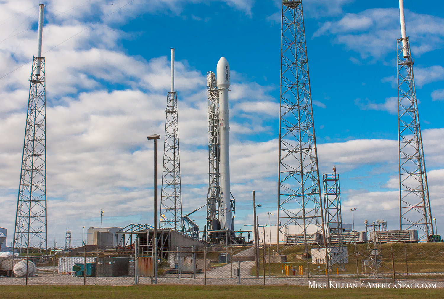 SpaceX is scheduled to launch their Falcon-9 rocket tonight on its first launch since the loss of CRS-7 last summer. The mission is to deliver 11 OG2 satellites to low-Earth orbit for Orbcomm, but SpaceX has a secondary objective to land the booster's first stage back at Cape Canaveral minutes after launch, on a landing pad at the Cape's former Launch Complex 13; it is now Landing Zone 1. Photo Credit: Mike Killian / AmericaSpace