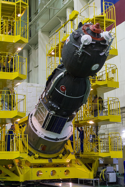 The Soyuz TMA-19M spacecraft is readied for encapsulation inside its payload shroud. Photo Credit: NASA