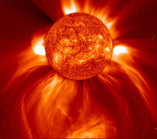 A huge Coronal Mass Ejection (CME) emerges from the Sun, as seen by SOHO in January 2002. Photo Credit: NASA