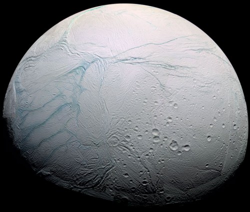 Saturn's moon Enceladus has a global ocean of water beneath its surface, similar to Europa. The Tiger Stripe fissures, which the plumes erupt from, are visible on the left (actually the south pole). Image Credit: NASA/JPL-Caltech