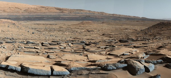 Sedimentary strata at the base of Mount Sharp as seen at the Kimberly location. The strata in the foreground dip toward Mount Sharp, providing evidence of the former lake-filled depression that used to exist before most of the mountain formed. Image Credit: NASA/JPL-Caltech/MSSS