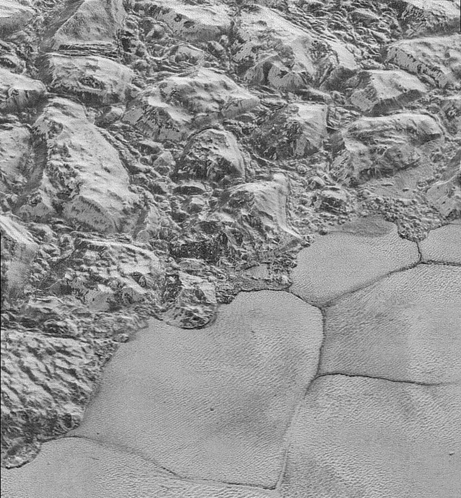 High-resolution image of Pluto from New Horizons, showing jumbled blocks in the water-ice crust, which border the smooth nitrogen-ice plains. Image Credit: NASA/JHUAPL/SwRI