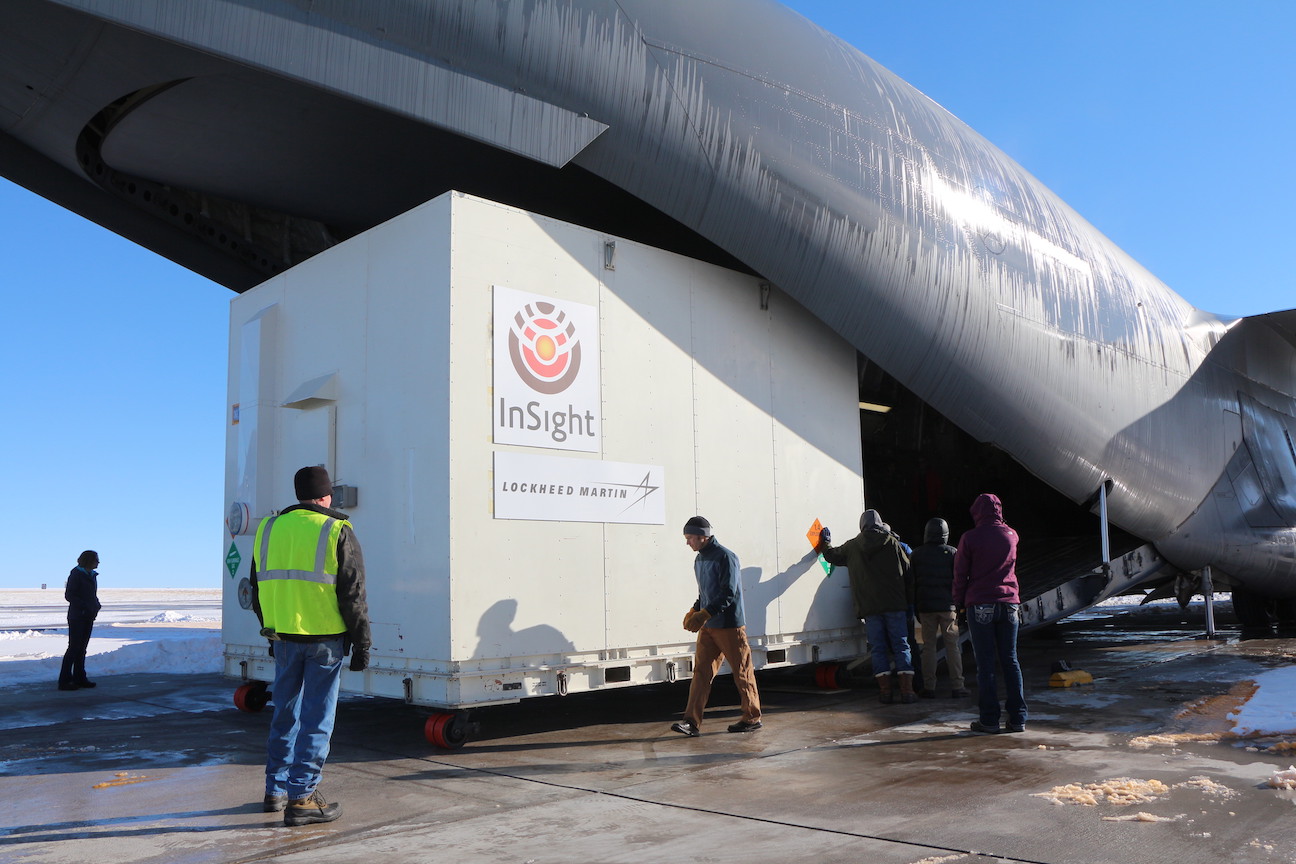 A crate containing the InSight lander is loaded onto a C-17 cargo aircraft at Buckley Air Force Base, Denver. Image Credit: NASA/JPL-Caltech/Lockheed Martin