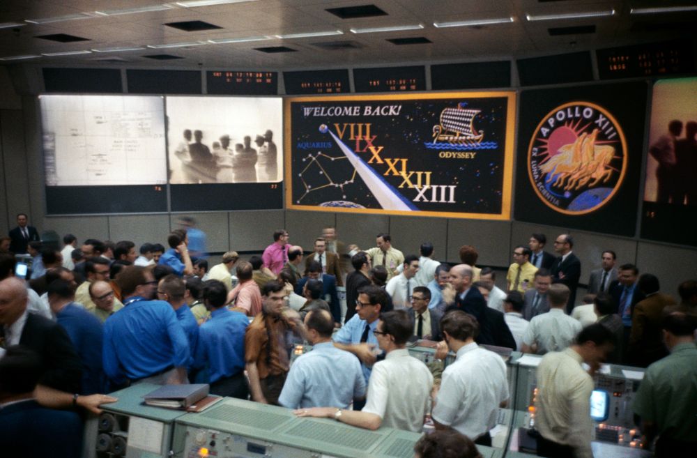 From NASA: "Overall view of the crowded Mission Operations Control Room (MOCR) in the Mission Control Center (MCC) at Manned Spacecraft Center during post-recovery ceremonies aboard the USS Iwo Jima, prime recovery ship for the Apollo 13 mission." Apollo 13's perilous voyage is recounted in Go, Flight! Photo Credit: NASA. Posted by AmericaSpace