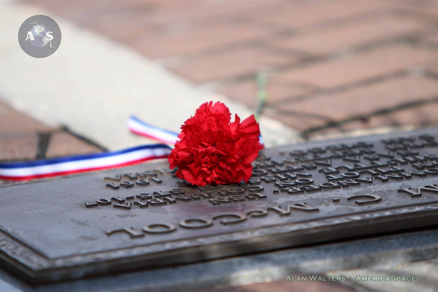 A single carnation decorates William McCool's plaque, who lost his life when Columbia broke up upon reentry in Feb. 2003. Photo Credit: Alan Walters / AmericaSpace