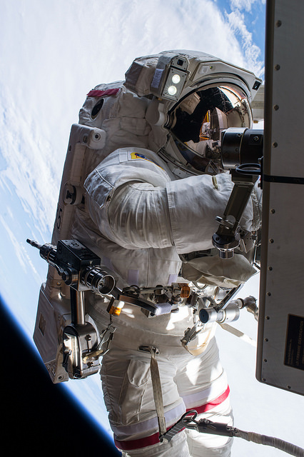 Although making his third career EVA today, this was Tim Kopra's first time as "EV1", the lead spacewalker. He wore red stripes on the legs of his suit for identification. Photo Credit: NASA