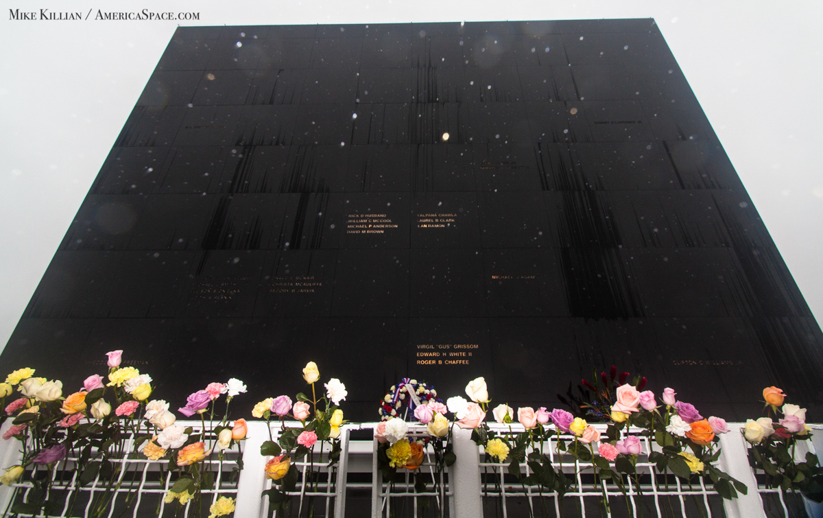 The Space Mirror Memorial, bedecked with flowers, was peppered by a light rain. For a while today, it seemed as if the skies of Cape Canaveral cried tears for America's loss. Photo Credit: Mike Killian/AmericaSpace