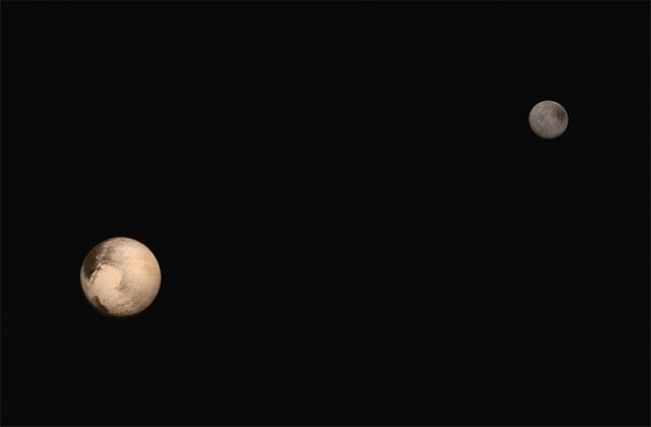 Pluto and its largest moon Charon. Photo Credit: NASA/JHUAPL/SWRI