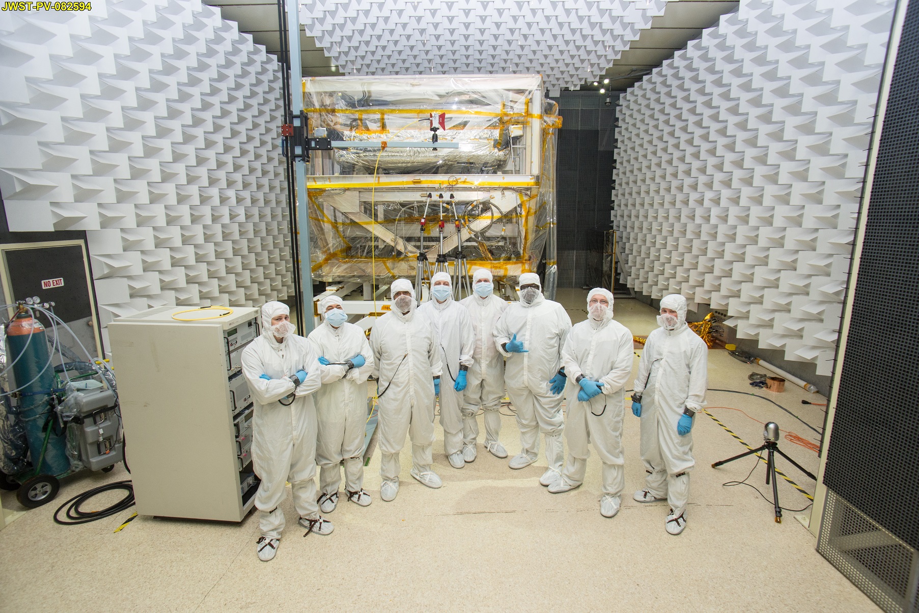 From NASA: "A team of engineers in special clean room suits at NASA Goddard. Seen from left to right: Andy Mentges, Nathan Block, Vaughn Nelson, Rob Houle, John McCloskey, Mark Branch, Rick Jones, Greg Jamroz." Photo Credit: NASA/Chris Gunn