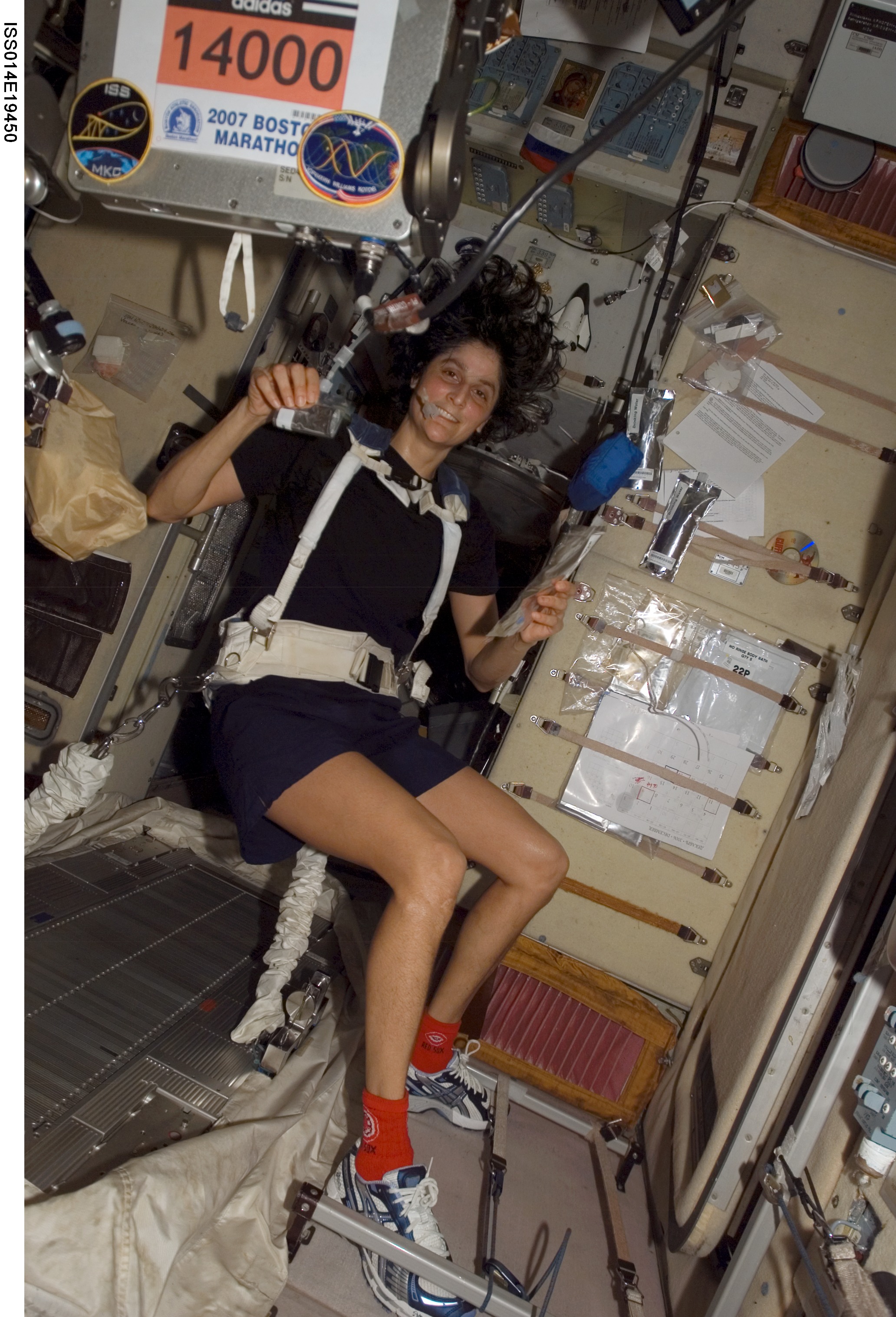 Astronaut Sunita L. Williams, Expedition 14 flight engineer, circled Earth almost three times as she participated in the Boston Marathon from space. She is seen here with her feet off the station treadmill on which she ultimately ran about six miles per hour while flying more than five miles each second. The treadmill is called TVIS, for Treadmill Vibration Isolation System, by the crewmembers and their ground support team. Williams' official completion time was four hours, 23 minutes and 10 seconds as she completed the race at 2:24 p.m. (EDT). Image Caption and Credit: NASA