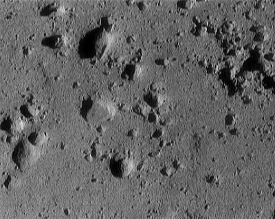 One of NEAR-Shoemaker's final views of Eros' surface, during the final descent on 12 February 2001. Photo Credit: NASA/JHU/APL
