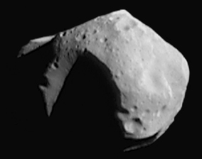 The intrinsically dark asteroid Mathilde, as seen by NEAR-Shoemaker in June 1997. Photo Credit: NASA/JHU/APL