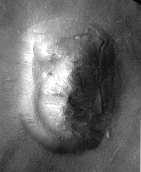 The Face on Mars, revealed by MRO to be a natural, wind-eroded mesa. Photo Credit: NASA/JPL-Caltech