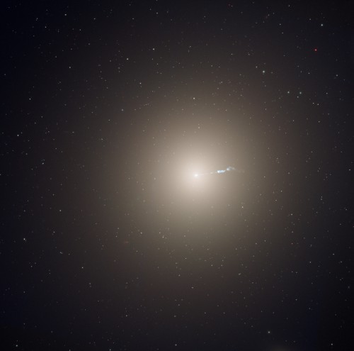 The giant elliptical galaxy M87 as seen from the Hubble Space Telescope. With a diameter of approximately 1 million light-years, M87 is 10 times bigger than our own galaxy. The discovery of 'super spirals' shows that spiral galaxies can also grow to enormous sizes. Image Credit: NASA, ESA, and the Hubble Heritage Team (STScI/AURA)