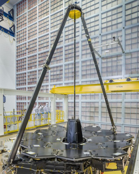 From NASA: "NASA's James Webb Space Telescope completed primary mirror sits in the cleanroom at NASA Goddard Space Flight Center, and supported over it on the tripod is the secondary mirror." Photo Credit: NASA/Chris Gunn