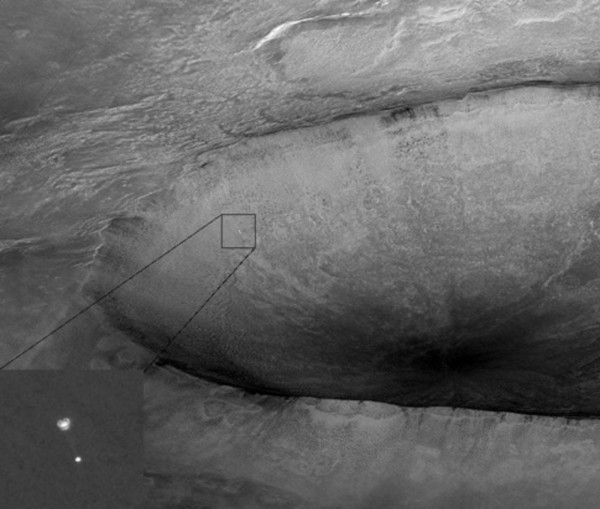 Image of the Mars Phoenix Lander, beneath its parachute, descending to the Martian surface in 2008, as seen by MRO. Image Credit: NASA/JPL/University of Arizona