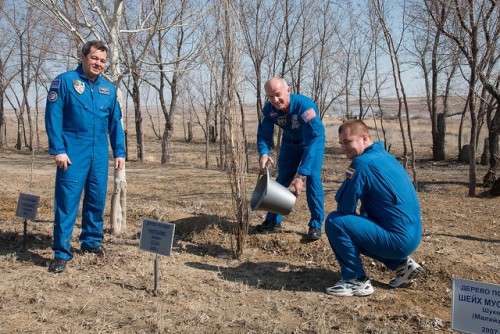 Skripochka, Williams and Ovchinin ceremonially plant trees in the Avenue of the Cosmonauts, ahead of their launch into space. Photo Credit: NASA