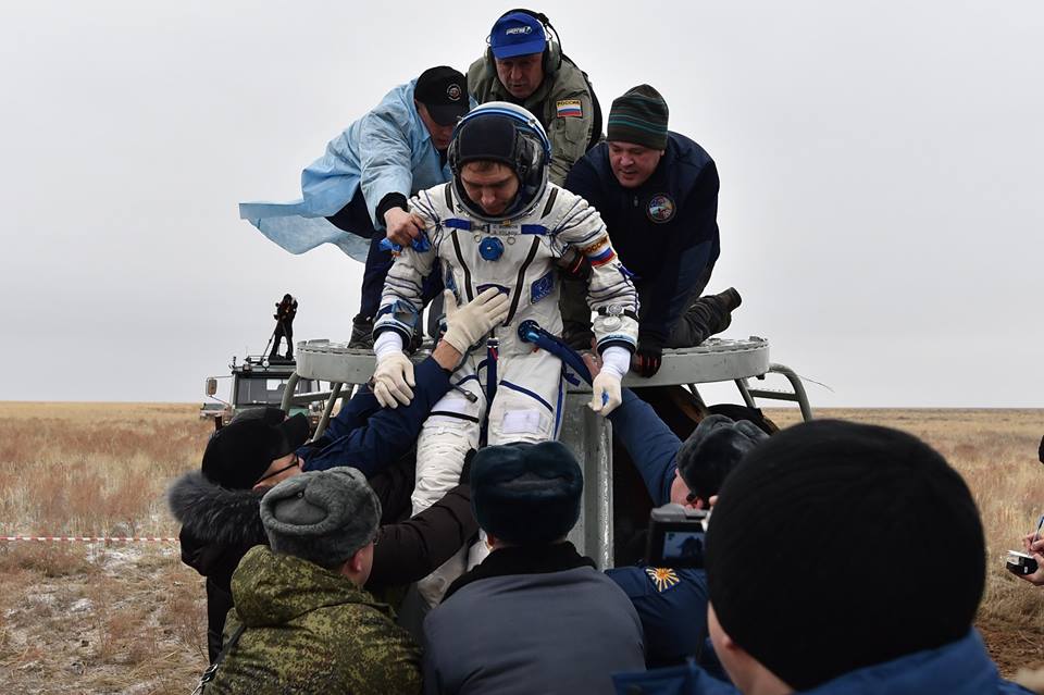 After almost 182 days in space, Sergei Volkov is assisted from the Soyuz TMA-18M descent module. Photo Credit: Roscosmos