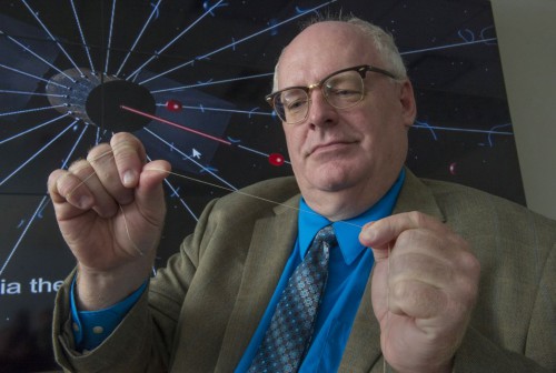 Bruce Wiegmann, principal investigator for HERTS, demonstrates the long, thin wires that will construct the E-Sail design. Each tether is extremely thin, having a width of only 1 millimeter. Image Credit: NASA/MSFC/Emmett Given