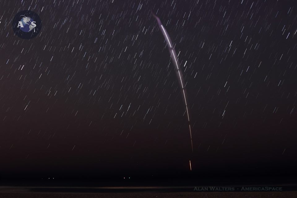The Falcon-9 first stage which helped deliver JCSAT-14 to orbit minutes earlier, comes down for a successful controlled vertical landing on SpaceX's offshore autonomous barge. Photo Credit: Alan Walters / AmericaSpace