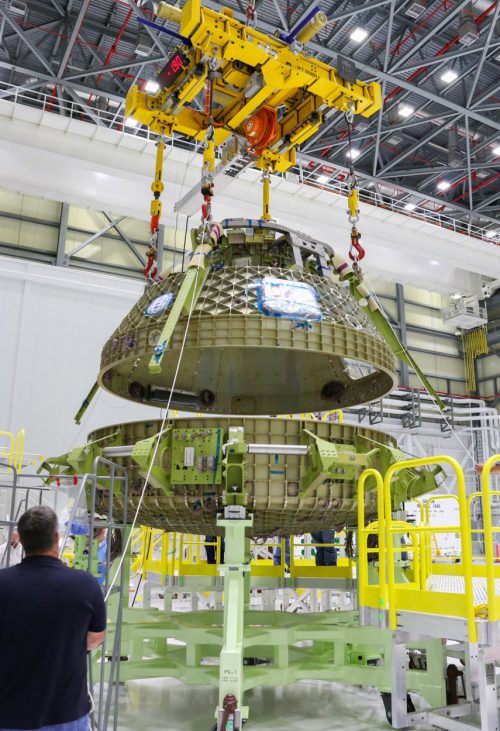 The upper and lowers halves of Boeing's CST-100 Starliner test article come together at KSC. Photo Credit: Boeing