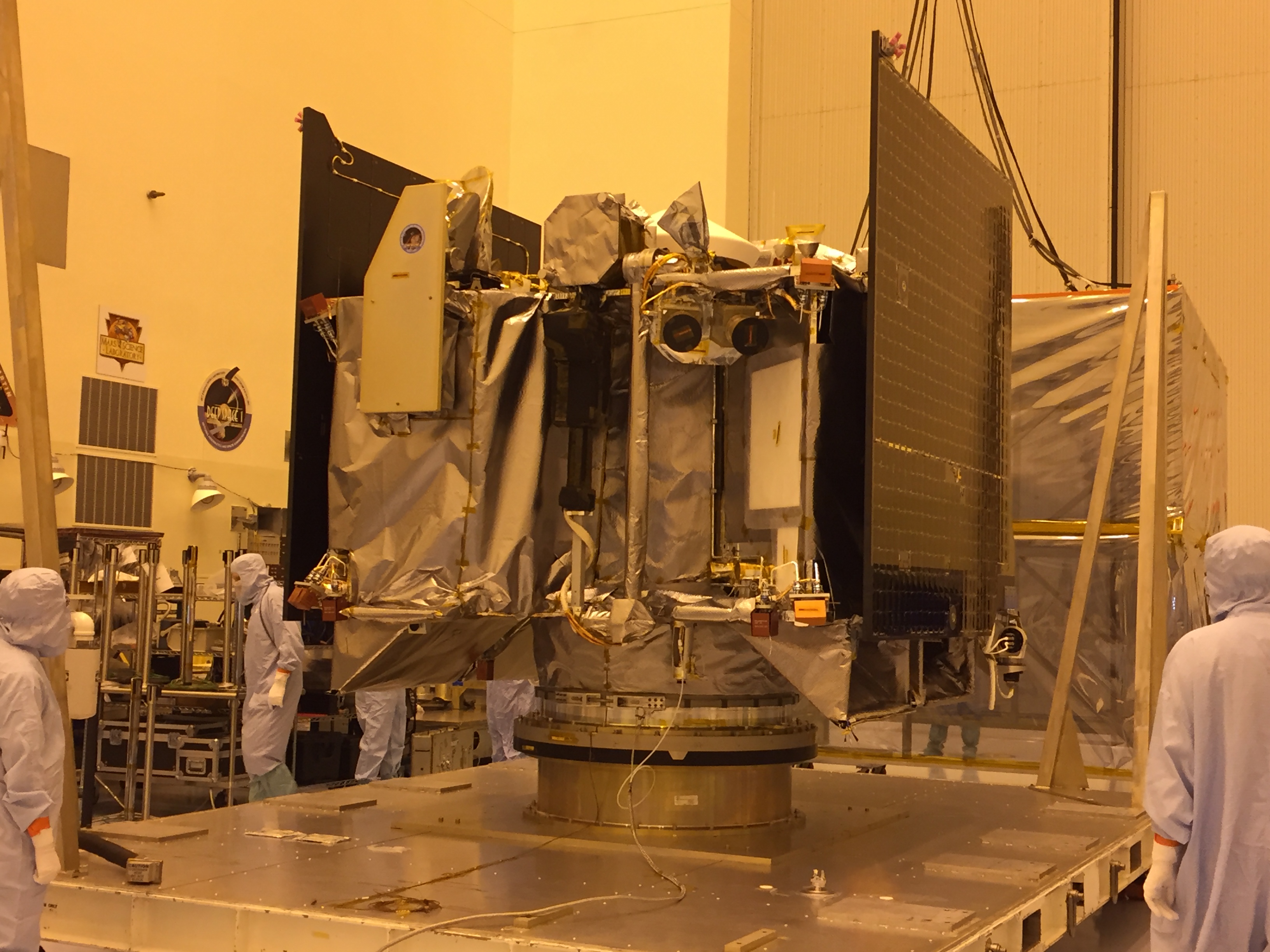 After arriving at NASA’s Kennedy Space Center, the OSIRIS-REx spacecraft sits on a launch vehicle adapter ring in the Payload Hazardous Servicing Facility. Credit: University of Arizona/Erin Morton