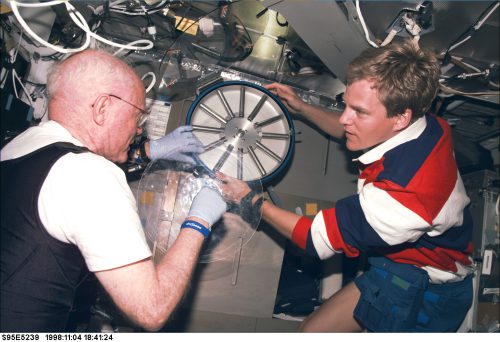 Scott Parazynski (right) works with Sen. John Glenn during STS-95 in the fall of 1998. Photo Credit: NASA