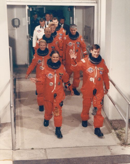 Tammy Jernigan and Bryan O’Connor lead the STS-40 crew out of the Operations & Checkout (O&C) Building to the launch pad on 5 June 1991. Photo Credit: NASA, via Joachim Becker/SpaceFacts.de