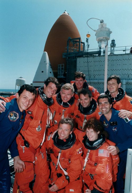 Although only seven of them would fly, Commander Tom Henricks described the STS-78 crew as nine-strong. Alongside the core crew, and here pictured in blue flight suits, were Alternate Payload Specialists (APS) Pedro Duque (left) and Luca Urbani. Photo Credit: NASA, via Joachim Becker/SpaceFacts.de