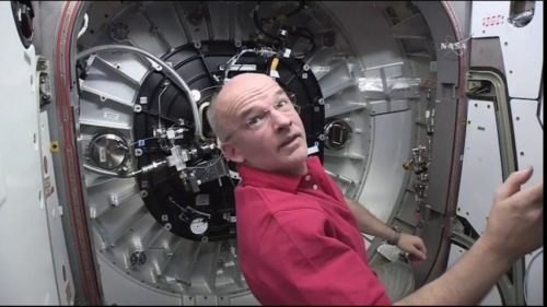 Jeff Williams is seen at work at the aft Common Berthing Mechanism (CBM) in the Tranquility node during BEAM expansion operations. Photo Credit: NASA