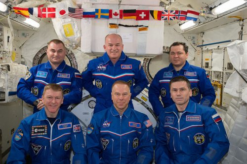 Less than a day before Soyuz TMA-19M departed the International Space Station (ISS), Expedition 47 Commander Tim Kopra (front center) handed the reins over to Expedition 48 Commander Jeff Williams (back center). Photo Credit: NASA