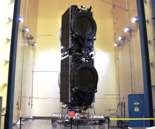 The Eutelsat 117 West B and ABS-2A "stack" of communications satellites are prepared for integration with the Upgraded Falcon 9. Photo Credit: SpaceX
