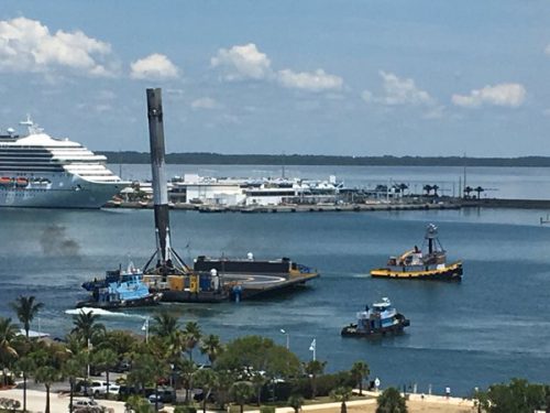 Leaning noticeably backwards, due to the crush core being used up in its landing legs, the Upgraded Falcon 9 first-stage from the Thaicom-8 mission returns to Port of Cape Canaveral aboard the Autonomous Spaceport Drone Ship (ASDS) on 2 June. Photo Credit: SpaceX