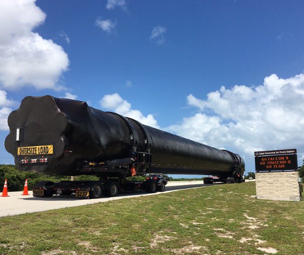 The Upgraded Falcon 9 first stage for the Eutelsat 117 West B and ABS-2A double-deployment mission arrives at Cape Canaveral on 27 May. Photo Credit: SpaceX