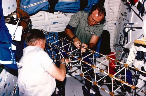 Mark Brown (left) and Jim Buchli work with the MODE hardware on Discovery's middeck. Photo Credit: NASA, via Joachim Becker/SpaceFacts.de