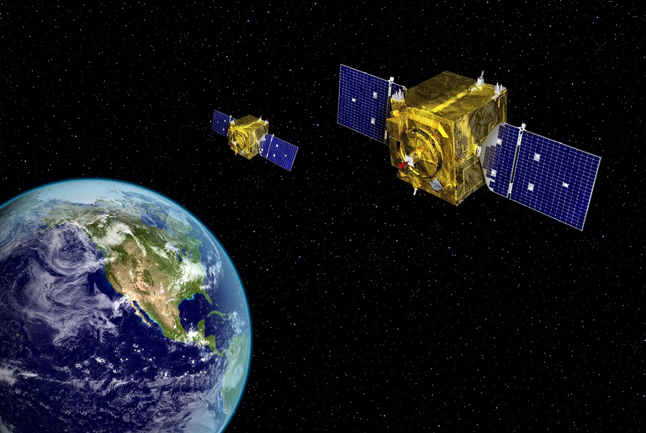 Air Force graphic depicts two GSSAP spacecraft operating in geosynchronous orbit at 22,300 mi. altitude. Photo Credit Air Force Space Command.