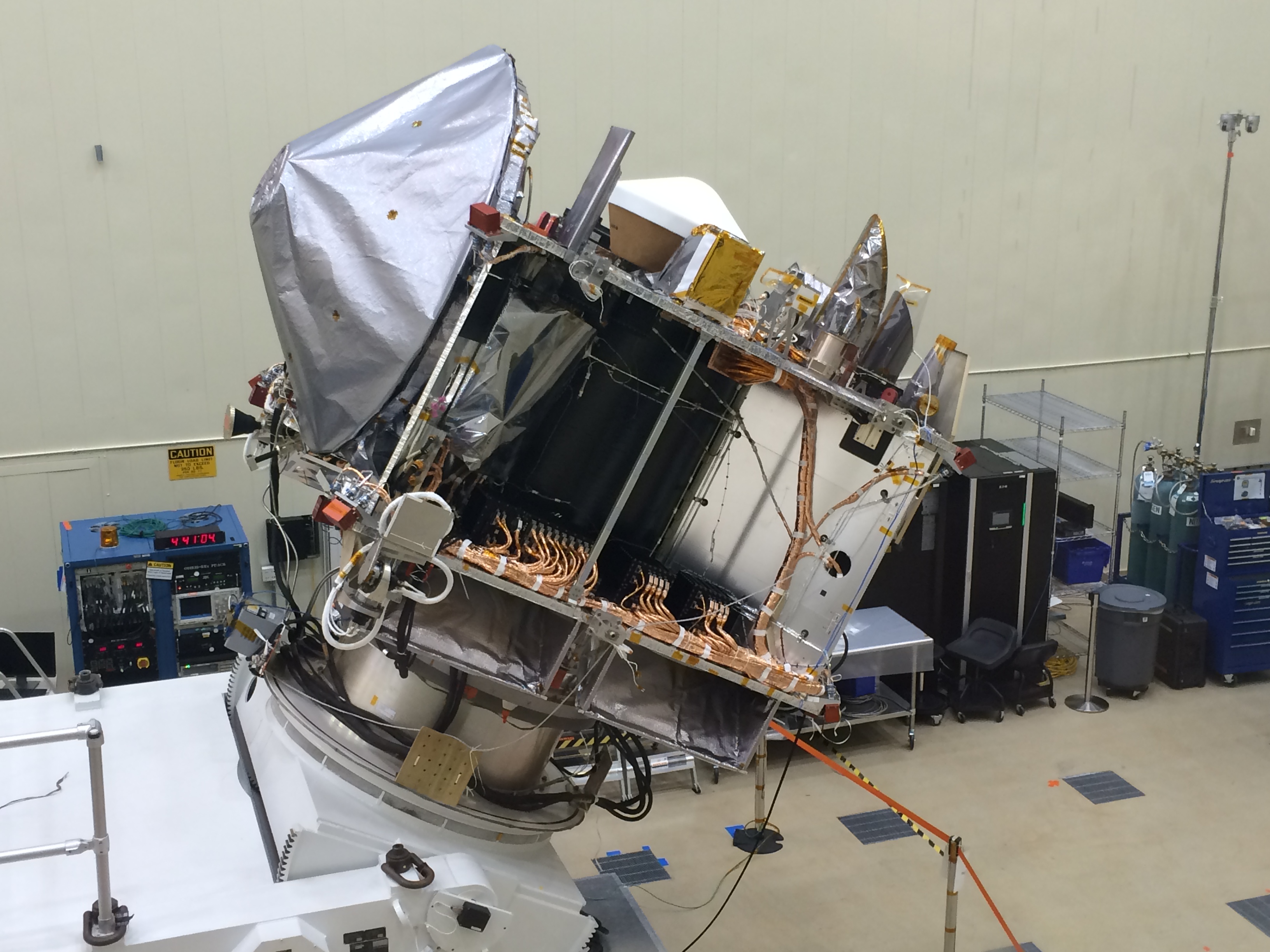 From U of Az.: "OSIRIS-REx in the clean room at Lockheed Martin in April 2016 after testing was completed and the TAGSAM arm was stowed for the final time." Photo Credit: University of Arizona/Christine Hoekenga