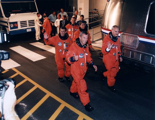Commander Bill Readdy (far right) and Pilot Terry Wilcutt lead their crew into the darkness for an pre-dawn liftoff on 16 September 1996. Photo Credit: NASA