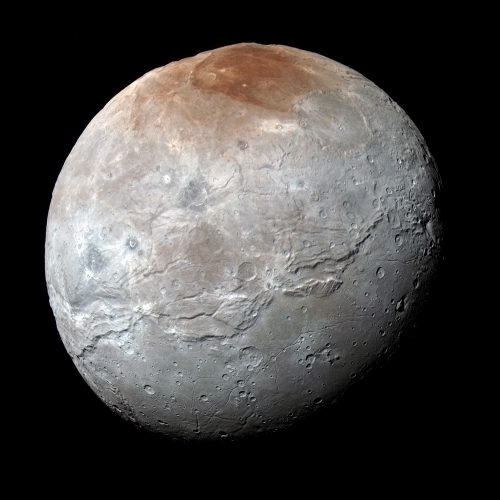 Pluto's largest moon Charon has an unusual reddish-colored north polar cap, and scientists think it results from methane escaping Pluto's atmosphere and condensing on Charon's cold surface. Sunlight then converts the methane ice into reddish tholins. Image Credit: NASA/Johns Hopkins University Applied Physics Laboratory/Southwest Research Institute