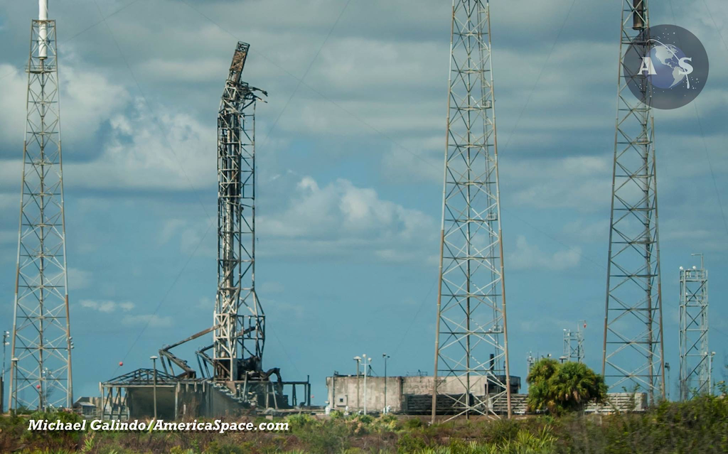 Hazmat crews surround SpaceX Launch Complex-40 at Cape Canaveral Air Force Station in Florida, days after the company suffered a catastrophic explosion of their Falcon-9 booster and losing the customer's payload which was already atop the rocket for its flight to orbit. Photo Credit: Michael Galindo / AmericaSpace