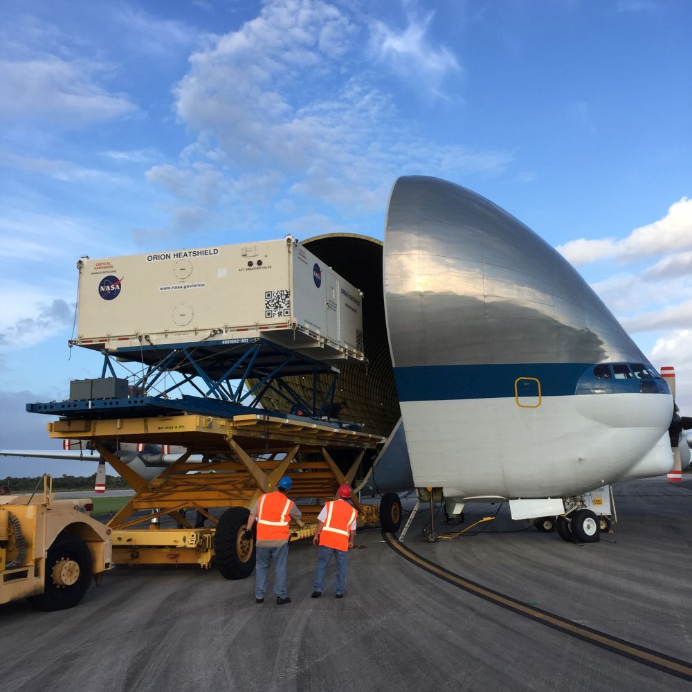 Orion EM-1 Heat Shield being offloaded from the Guppy aircraft at the Shuttle Landing Facility operated by Space Florida at NASA's Kennedy Space Center. Photo credit: NASA/Dimitri Gerondidakis