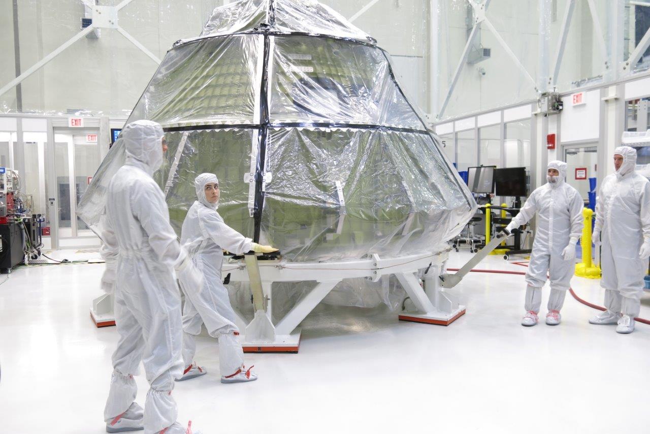 From NASA: "The Orion crew module for Exploration Mission 1 was transferred into the clean room inside the Neil Armstrong Operations and Checkout Building at Kennedy Space Center in late July to begin installation of the spacecraft's critical systems, including propellant lines." Photo Credit: NASA
