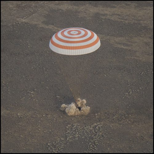 The six solid-fueled landing rockets in the base of the Soyuz MS-01 descent module ignite, moments before touchdown, to cushion the impact. Photo Credit: NASA