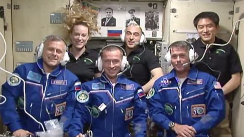 The six-strong Expedition 49 crew gathers to speak to media, family and well-wishers after hatch opening. From left to right are Andrei Borisenko, Kate Rubins, Sergei Ryzhikov, Anatoli Ivanishin, Shane Kimbrough and Takuya Onishi. Photo Credit: NASA