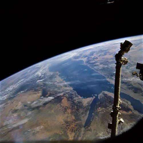 Endeavour's mechanical arm, backdropped by a glorious view of the Gulf of Suez. Photo Credit: NASA