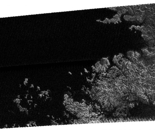 Alien seas: Cassini's radar and other instruments have shown Titan to be a world of methane/ethane rain, rivers, lakes and seas. This view shows a shoreline of one of the seas. Image Credit: Cassini Radar Mapper/JPL/ESA/NASA