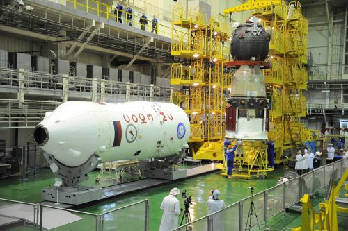 The Soyuz MS-03 spacecraft (at right) is readied for encapsulation inside its Soyuz-FG payload fairing. Photo Credit: NASA/Peggy Whitson/Twitter
