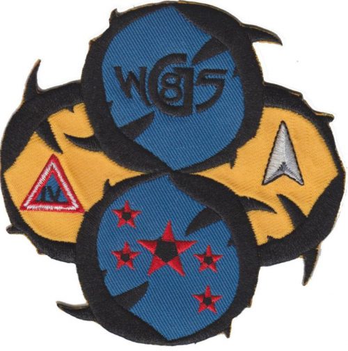 The USAF launch patch for the WGS 8 mission shows circling sharks for "The Sharks" nickname of the 45th Space Wing. The sharks are swimming circles around insignias for key mission participants. The Sharks insignia derives from the teeth earlier painted on the nose of all 14th Air Force aircraft and later launch vehicle. (USAF image)