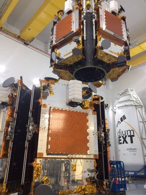 The first ten IridiumNEXT satellites being stacked for flight atop a SpaceX Falcon 9 rocket for a Jan. 8 launch attempt at 10:28am Pacific time. Photo Credit: Iridium 
